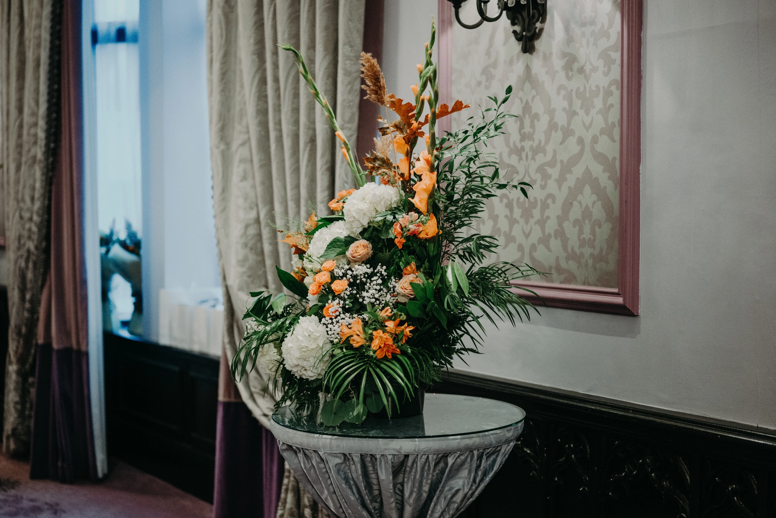 Wedding Cake with Fresh Flowers by Flowers Touch at Clontarf Castle Hotel Elegant wedding cake decorated with fresh autumn flowers by Flowers Touch at Clontarf Castle Hotel, Dublin