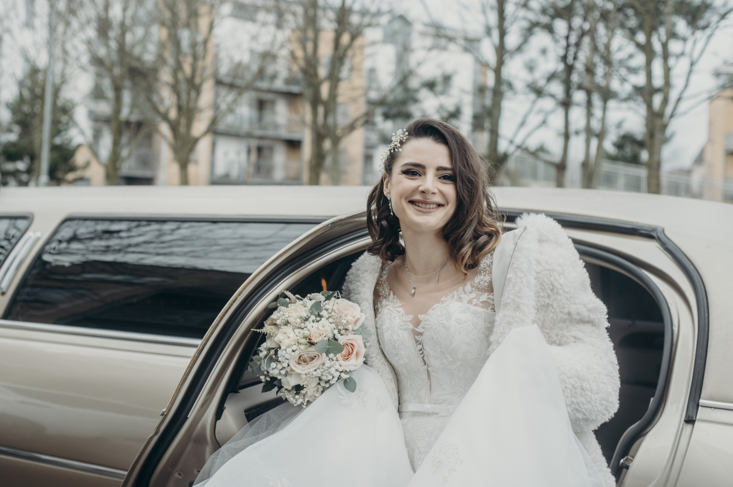 Romantic winter bridal bouquet with blush and white roses by Flowerstouch at Fitzpatrick Castle Hotel