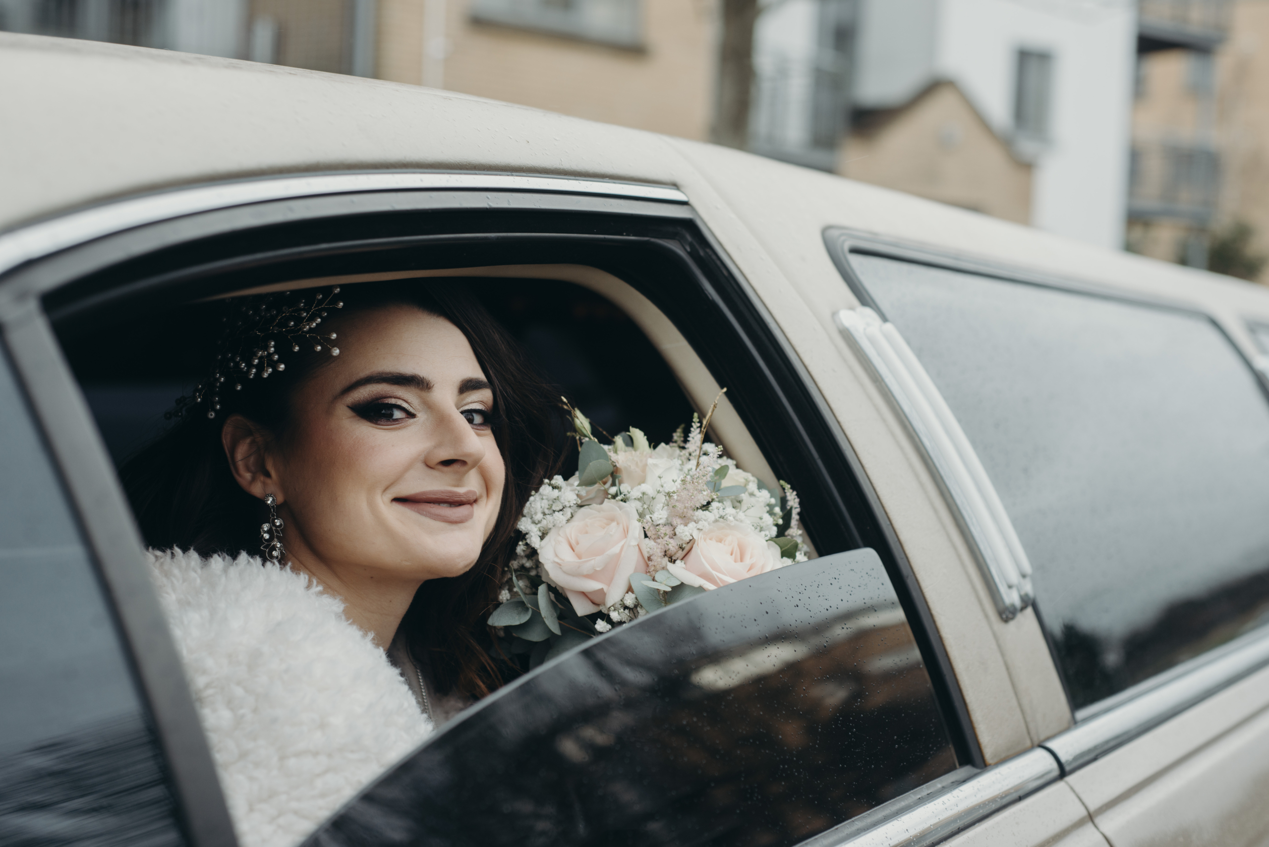 Hand-tied bridal bouquet featuring eucalyptus and roses by Flowerstouch at Fitzpatrick Castle Hotel