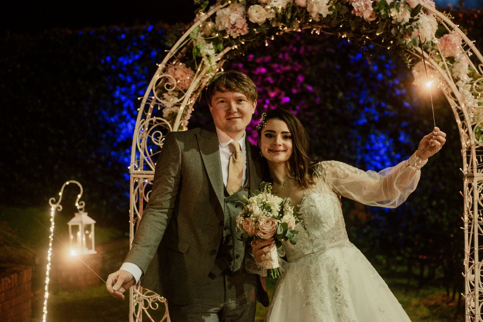Magical illuminated wedding floral arch venue styling by Flowerstouch at Fitzpatrick Castle Hotel